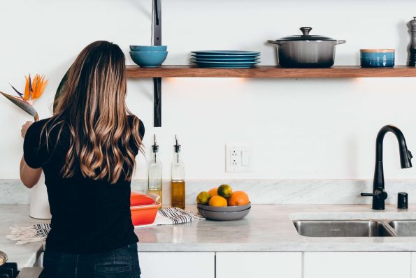 woman preparing a meal in a modern kitchen